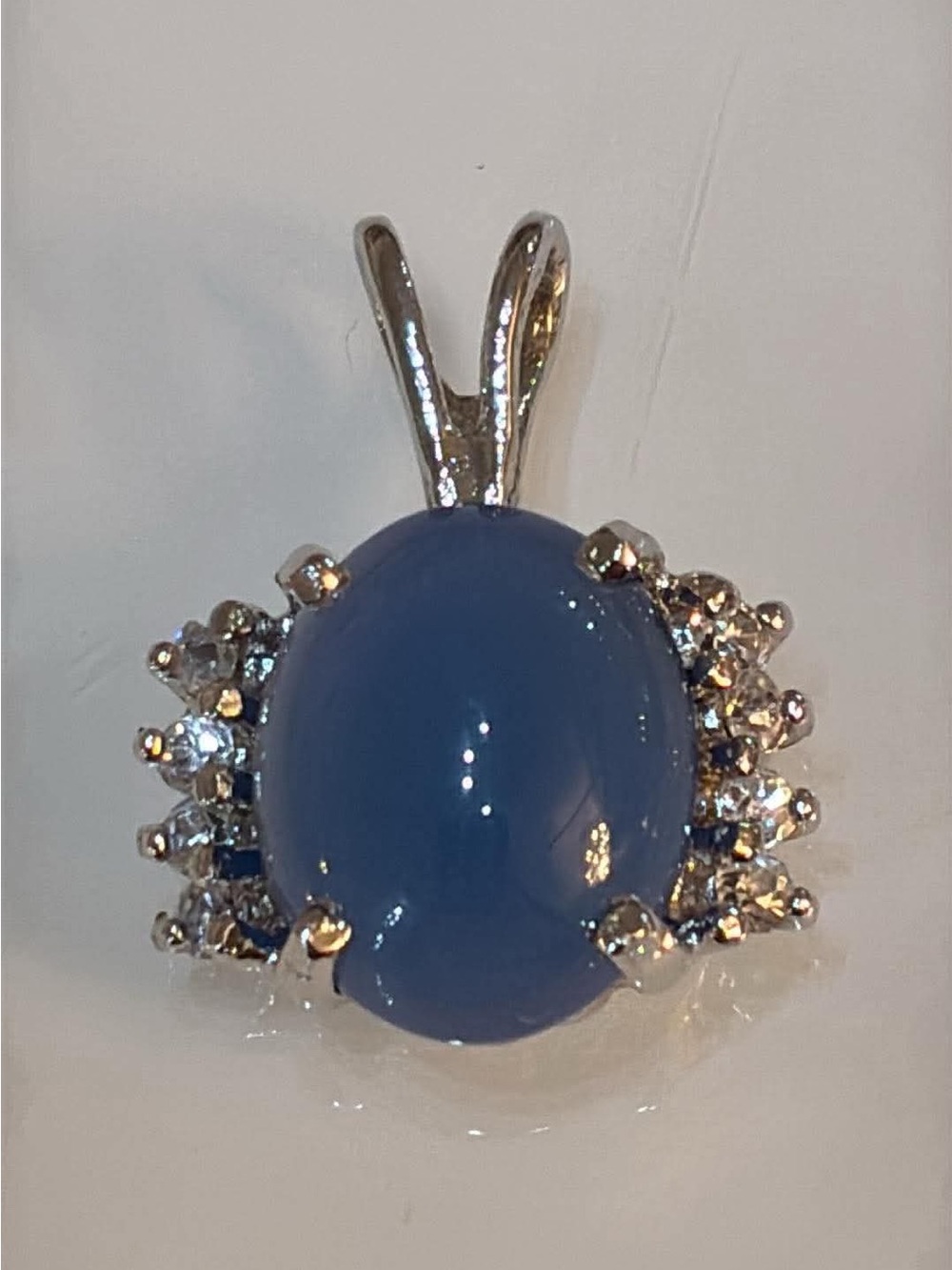 Sterling Silver Blue Oval Cabochon Halo Pendant
